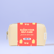 Cosmetic bag with red label and yellow stripes on a light purple background